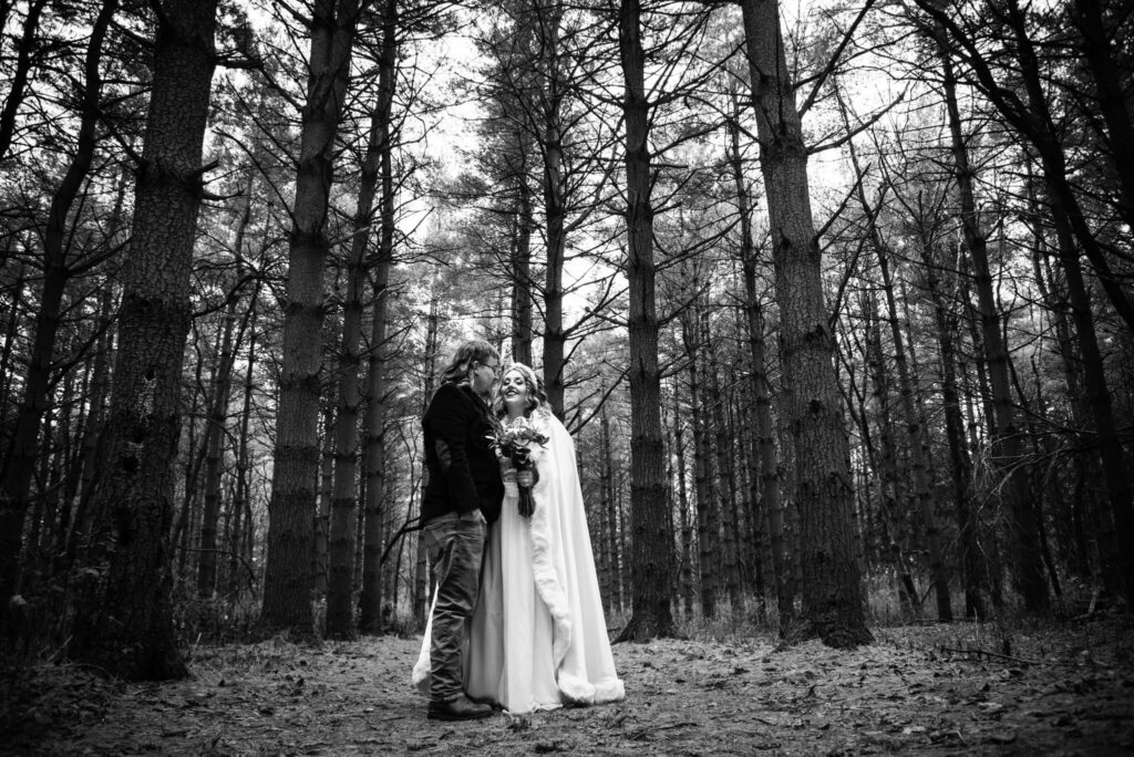 bride and groom in pine forest for wedding